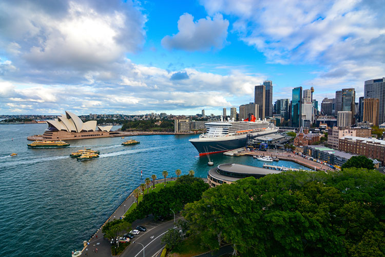 Wide view of Sydney Harbour, Circular Quay, and the Opera House.