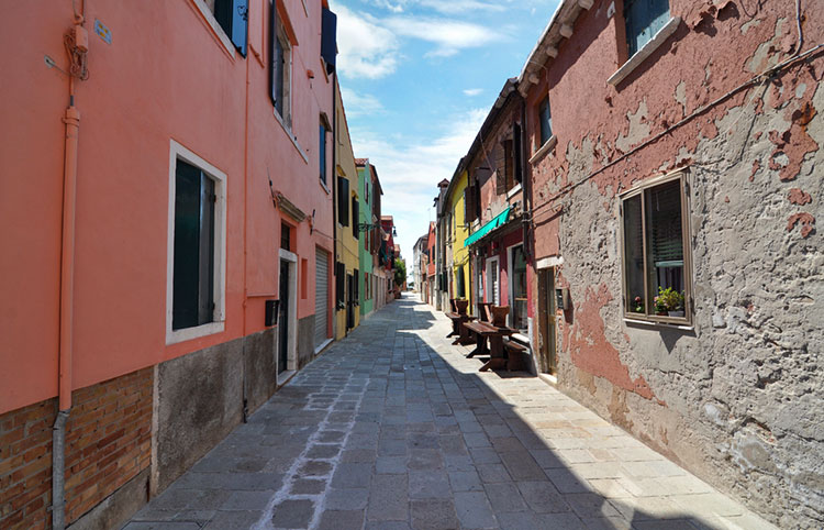 Colorful buildings along a residential street in the settlement of Malamocco.
