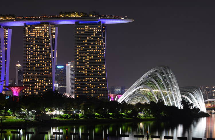 Marina Bay Sands and Gardens by the Bay at night.