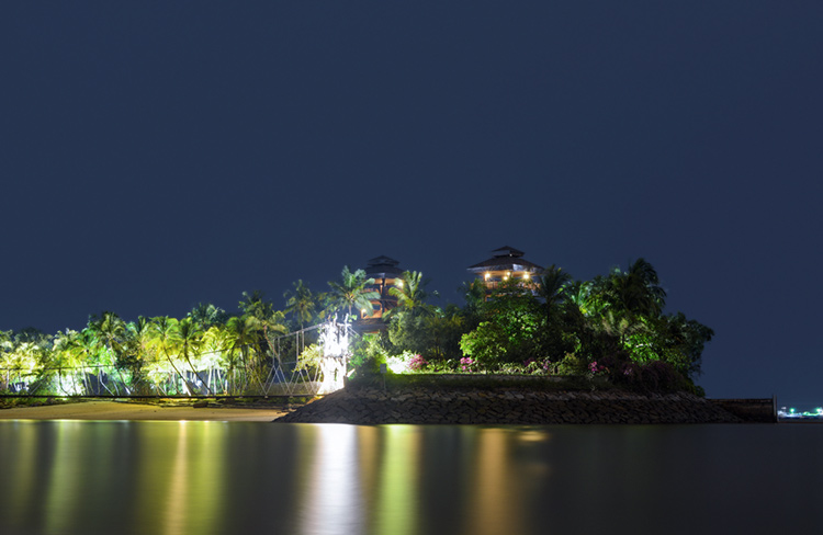 Islet at Palawan Beach with reflections in the sea.