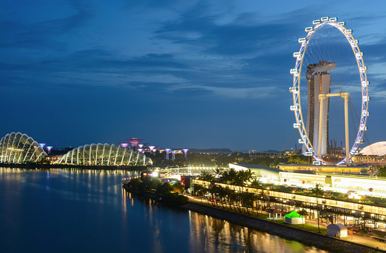 Long-exposure of the Singapore Flyer and Marina Bay at night.