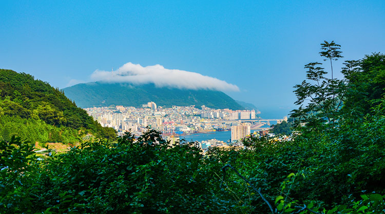 Cap-like cloud topping the peak over Mount Chinjong.